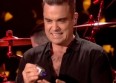 Robbie Williams touche ses fans et se désinfecte
